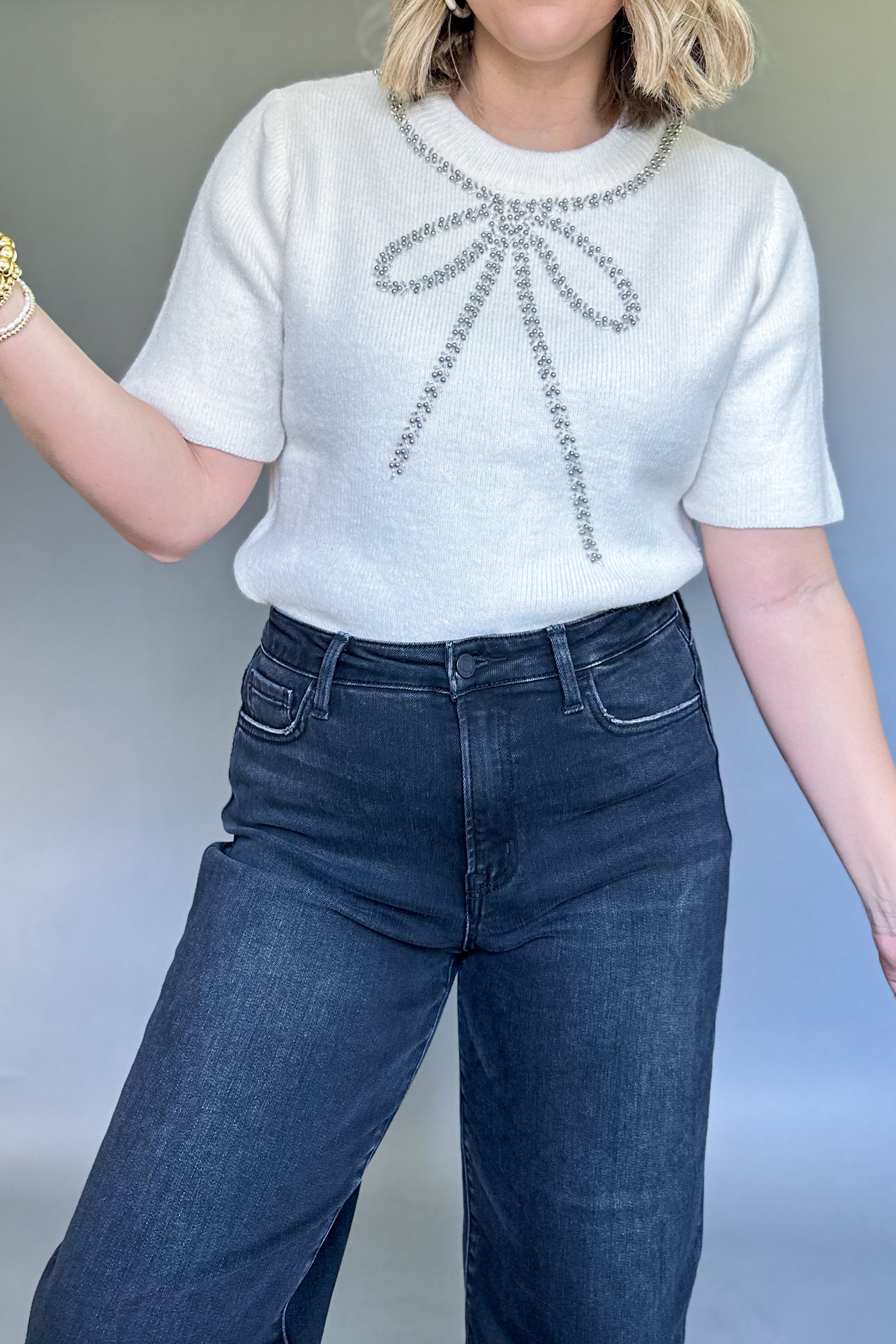 white sweater bow top